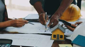 Hands of architect or engineer working on blueprint meeting for project working with partner on model building and engineering tools in working site, Construction and structure concept. video