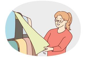 Woman in glasses choosing wallpapers in shop. Smiling female client look at samples in store for house interior renovation. Vector illustration.