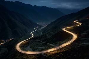 AI generated Curvy mountain road with trailing lights at night photo