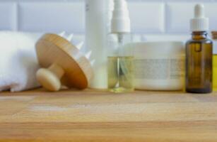 Hair care products on a wooden background. Selective focus. photo