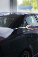 Contactless car wash self-service. Pressure washing machine. photo