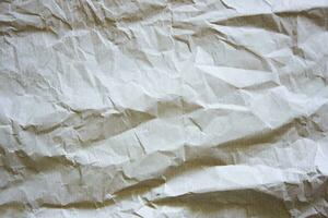 Texture of crumpled paper. Light textured background. photo