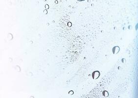 Abstract background with water drops on glass. photo