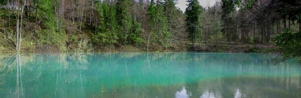 One of the four mountain lakes called Kolorowe jeziorka . Beautiful mountain turquoise lake. Panorama. photo