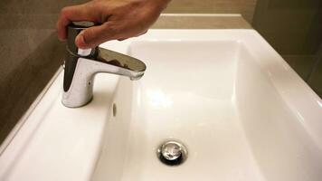 Hands are washing by water in rest room video