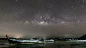 milky way and star againts night sky reflect on water video