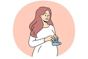 Smiling pregnant woman with baby shoes vector