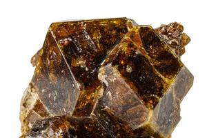 Macro stone Grossular mineral on white background photo