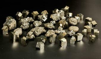 Macro mineral stone Pyrite on a black background photo