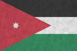 Jordán bandera representado en brillante pintar colores en antiguo alivio enlucido pared. texturizado bandera en áspero antecedentes foto