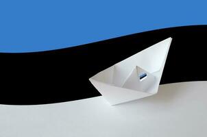 Estonia flag depicted on paper origami ship closeup. Handmade arts concept photo