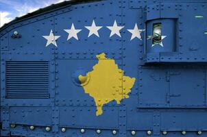 Kosovo flag depicted on side part of military armored tank closeup. Army forces conceptual background photo