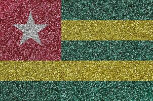 Togo flag depicted on many small shiny sequins. Colorful festival background for party photo