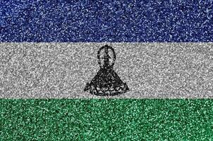 Lesotho flag depicted on many small shiny sequins. Colorful festival background for party photo