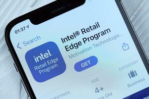 KHARKOV, UKRAINE - MARCH 5, 2021 Intel icon and application from App store on pro display screen on white table photo