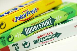 KHARKOV, UKRAINE - FEBRUARY 14, 2021 Wrigleys Spearmint Doublemint and Juicy Fruit chewing gum in classic design photo