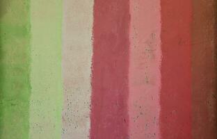 Texture of an old metal wall, painted in several different colors photo