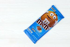 KHARKOV, UKRAINE - MARCH 15, 2021 M M's milk chocolate bar. M M's produced by Mars Incorporated photo