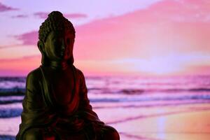 Buddha Purnima and Vesak day concept, Buddha statue with low key light against beautiful and colorful background. Meditation photo