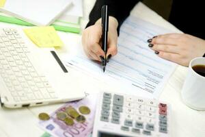 Accountant fill italian tax form F24 Unified payment model in end of tax period. Taxation and paperwork routine photo
