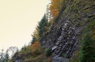 Autumn rural landscape with mountains peaks on background photo