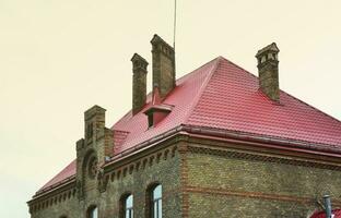 Fragment of a metal roof of the restored old multi-storey building in Lviv, Ukraine photo