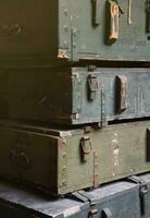 Soviet army ammunition stack of green crates with russian names of ammo type and category photo