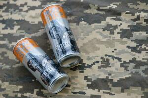 KYIV, UKRAINE - OCTOBER 31, 2023 Non Stop energy drink with limited edition design of Stalker and character with gas mask on aluminium tin can photo