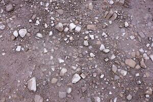 Background of shattered stony stones surface in mountain area. Texture with natural light photo