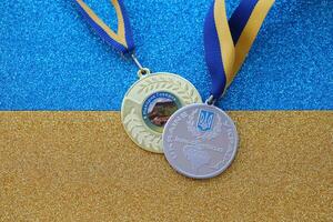 KYIV, UKRAINE - MAY 4, 2022 Medal for the person who conquered Mount Hoverla photo