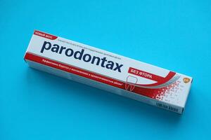 KYIV, UKRAINE - MAY 4, 2022 Package of Parodontax toothpaste on bright background photo