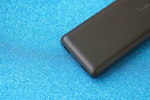 KYIV, UKRAINE - MAY 4, 2022 Portable Powerbank battery with logo of Belkin International photo