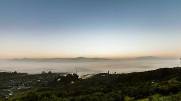 cloudy foggy landscape view above of mountain at sunrise timing video