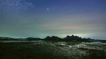 milky way and star againts night sky reflect on water video