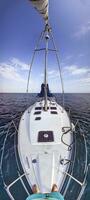 Vertical panorama of a yacht on the sea taken from front to back photo