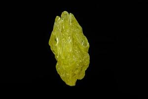 Macro mineral sulfur stone on a black background photo