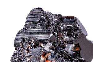 macro mineral stone sherle, schorl, black tourmaline on white background photo