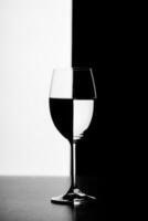 a glass of water and smoke on a black and white background photo