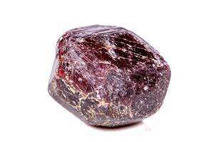 Macro of a mineral garnet stone on a white background photo