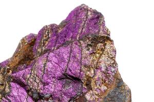 Macro mineral stone purpureus, purple purpurite in the breed a white background photo