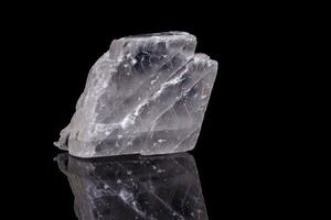 Macro mineral stone Iceland spar on black background photo