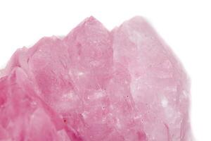 Macro mineral stone Rose quartz on white background photo