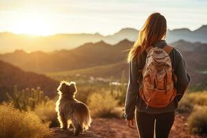 ai generado mujer y perro excursionismo en montañas foto
