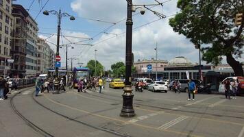 turkey istanbul 1 june 2023. T1 tram at Eminonu with people crossing the road video