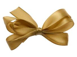 Tied bow made of golden silk ribbon on an isolated background, decor for a gift photo