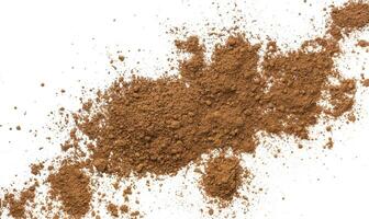 Pile cocoa powder isolated on white background. Top view photo