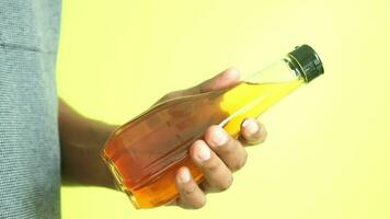 hand holding a bottle of olive oil video