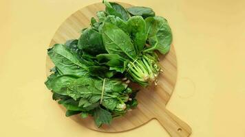 Fresh spinach leaves on a chopping board video