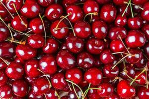 Red ripe sweet cherry with stalk. Food, berry background. photo