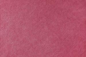 Magenta velveteen upholstery fabric texture background. photo